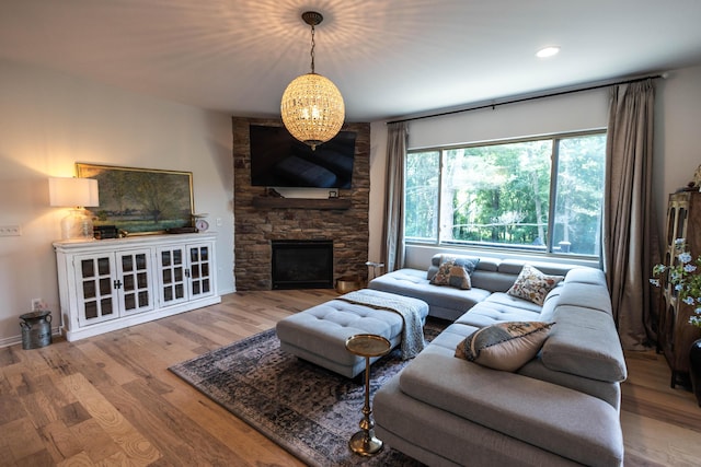 270 Fairway View Dr, Oxford, MI 48371 - living area with wood finished floors, a stone fireplace, and recessed lighting