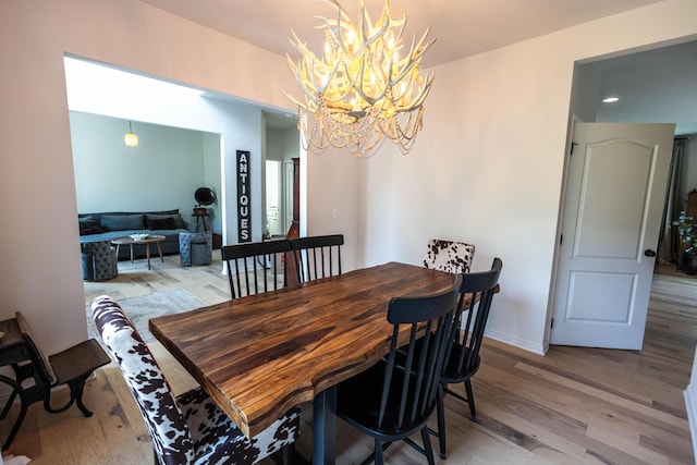 270 Fairway View Dr, Oxford, MI 48371 - dining room featuring a chandelier and light wood-style floors
