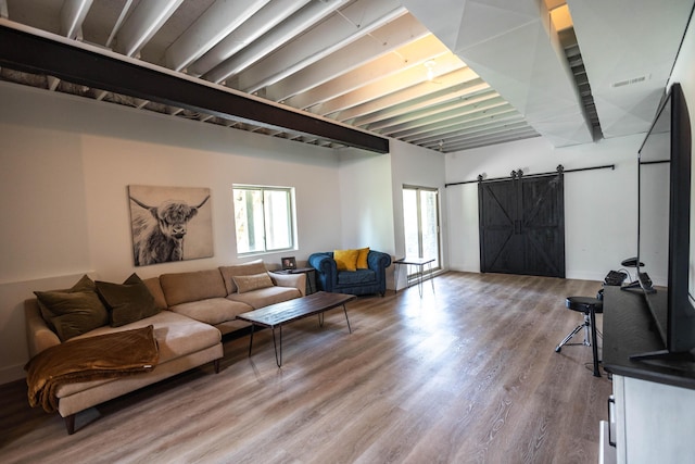 270 Fairway View Dr, Oxford, MI 48371 - living area with a barn door and wood finished floors