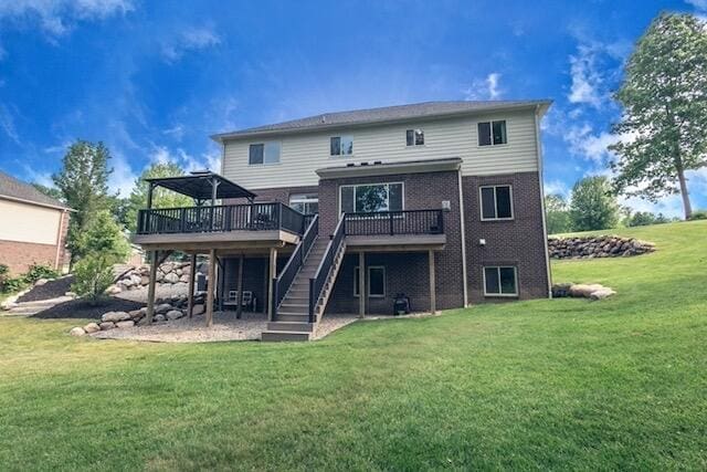 270 Fairway View Dr, Oxford, MI 48371 - rear view of house with a deck, stairs, a yard, and brick siding