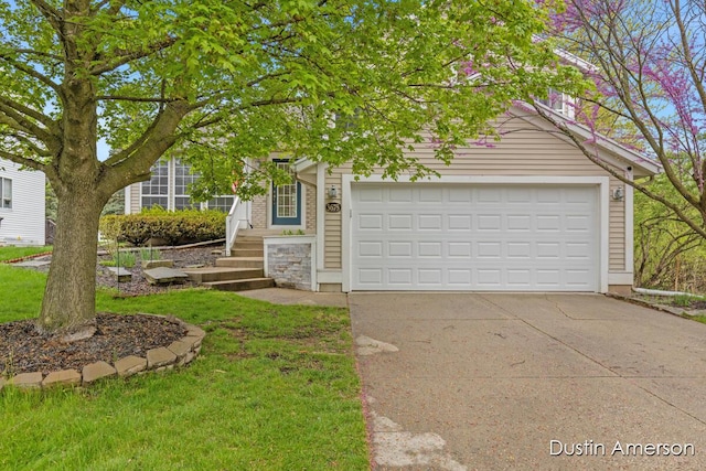 obstructed view of property featuring concrete driveway, a garage, and a front yard