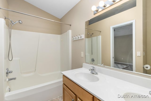 full bathroom featuring tub / shower combination, double vanity, and vaulted ceiling