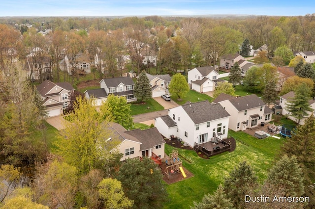 aerial view of residential area with a heavily wooded area