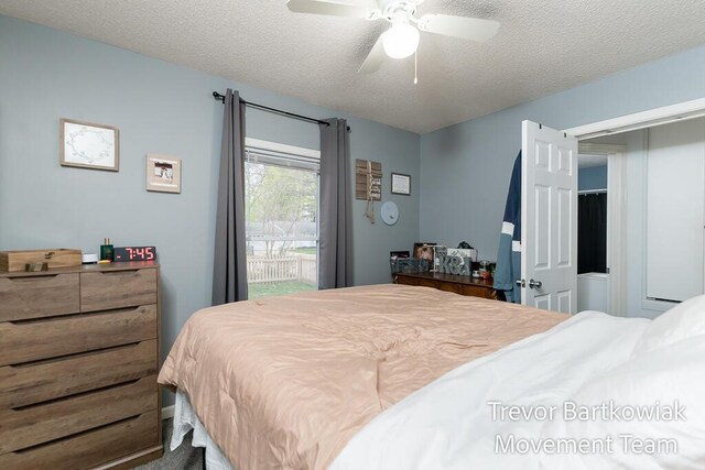 bedroom with access to outside, a textured ceiling, and ceiling fan