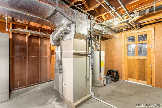 unfinished basement featuring heating unit and gas water heater