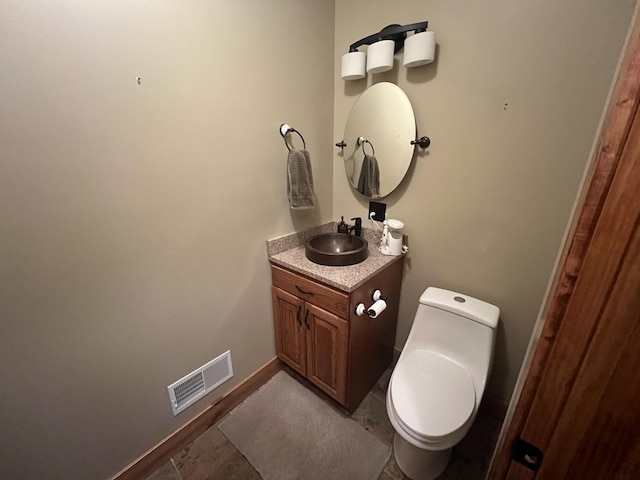 6425 S Taylor Rd, Branch, MI 49402 - half bathroom with vanity, baseboards, toilet, and visible vents