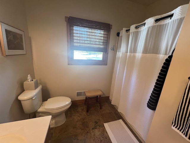 6425 S Taylor Rd, Branch, MI 49402 - bathroom with visible vents, vanity, toilet, baseboards, and a shower with curtain