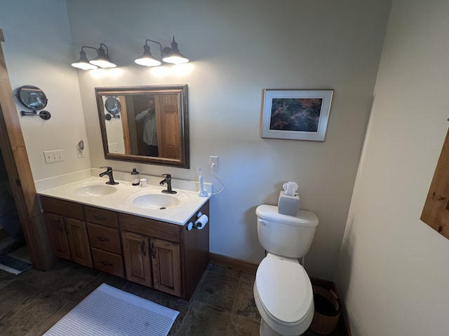 6425 S Taylor Rd, Branch, MI 49402 - full bathroom featuring a sink, baseboards, toilet, and double vanity
