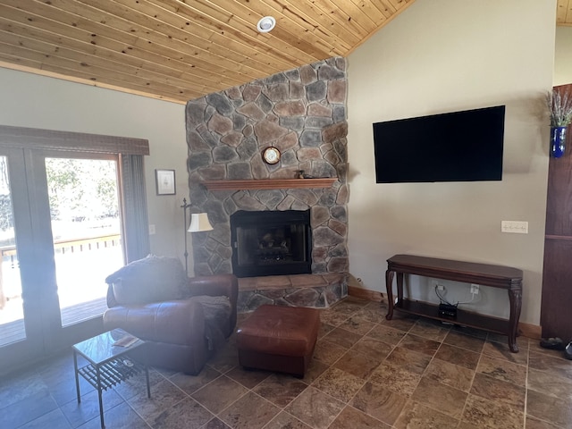 6425 S Taylor Rd, Branch, MI 49402 - living area with a fireplace, baseboards, wood ceiling, stone finish flooring, and vaulted ceiling