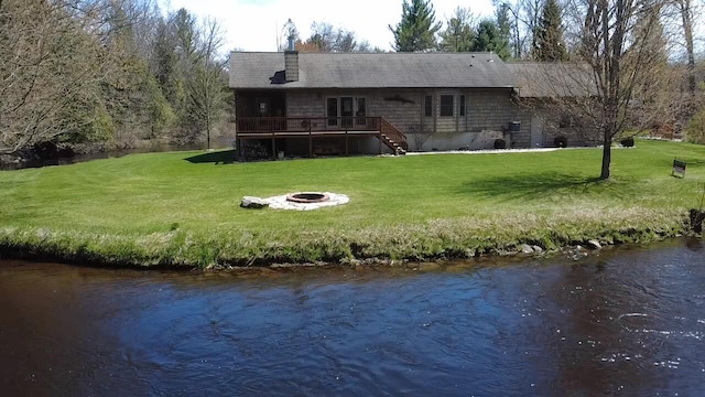 6425 S Taylor Rd, Branch, MI 49402 - back of property with stairs, an outdoor fire pit, a yard, and a deck with water view