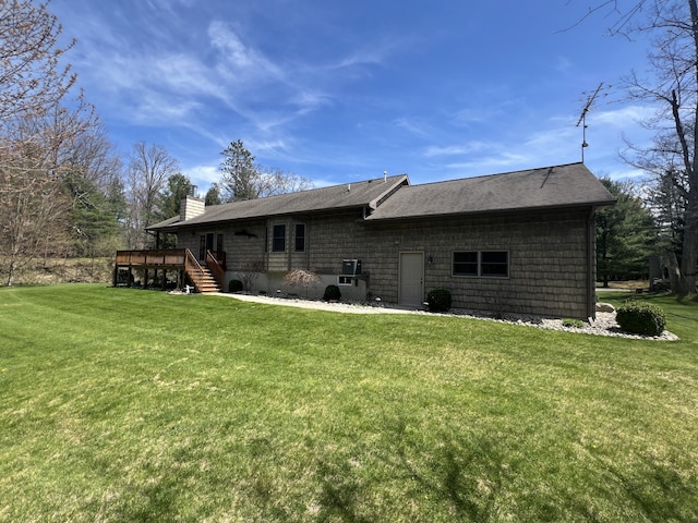 6425 S Taylor Rd, Branch, MI 49402 - rear view of property with stairs, a chimney, a yard, and a deck