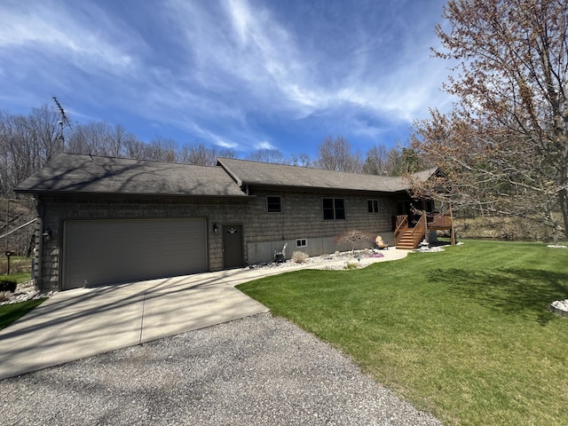 6425 S Taylor Rd, Branch, MI 49402 - view of front of property with concrete driveway, an attached garage, a shingled roof, and a front lawn