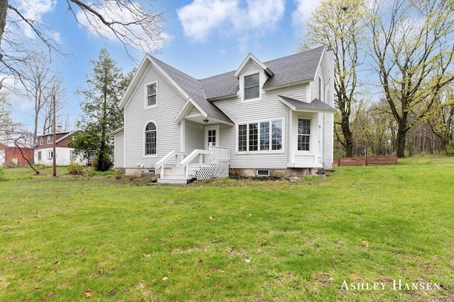 12978 Mason Dr, Grant, MI 49327 - cape cod house featuring roof with shingles and a front lawn