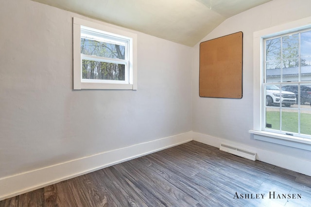 12978 Mason Dr, Grant, MI 49327 - empty room featuring baseboards, plenty of natural light, dark wood-style flooring, and lofted ceiling