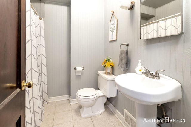 12978 Mason Dr, Grant, MI 49327 - full bathroom featuring toilet, tile patterned floors, and baseboards