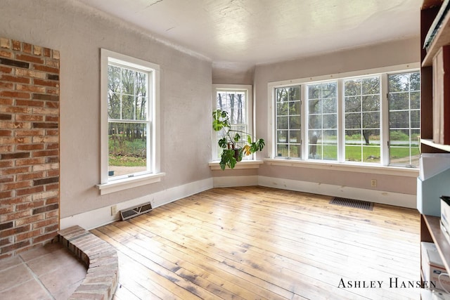 12978 Mason Dr, Grant, MI 49327 - unfurnished sunroom featuring visible vents
