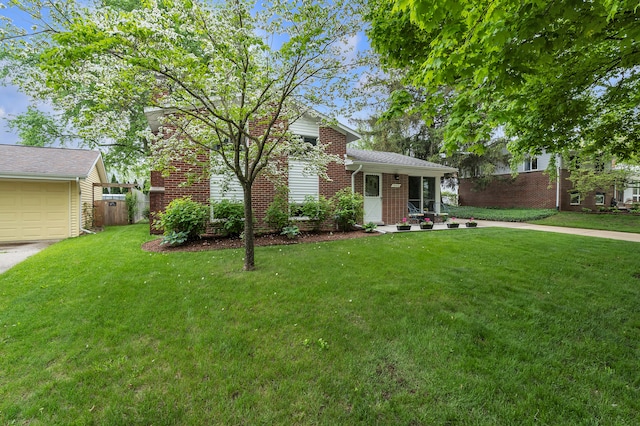 3622 Cushing Ct, Dexter, MI 48130 - view of front of house featuring brick siding and a garage
