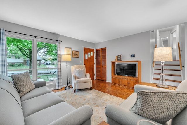 3622 Cushing Ct, Dexter, MI 48130 - living area featuring stairway and baseboards