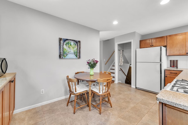 3622 Cushing Ct, Dexter, MI 48130 - dining area with recessed lighting, stairs, and baseboards