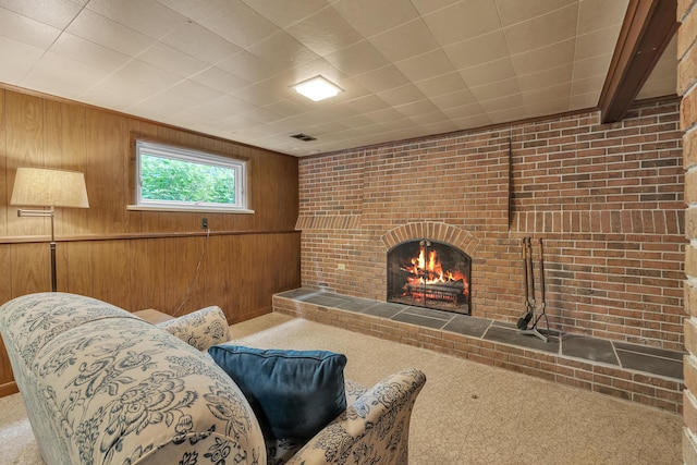 3622 Cushing Ct, Dexter, MI 48130 - living area with wood walls, a brick fireplace, and brick wall