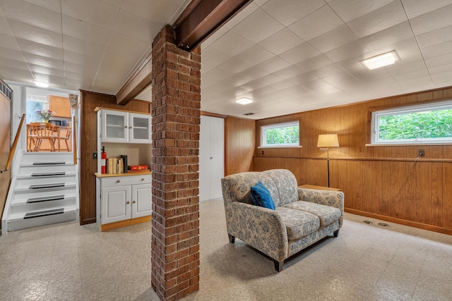 3622 Cushing Ct, Dexter, MI 48130 - living area featuring wooden walls and stairs