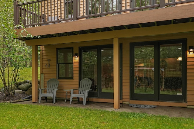 326 Greentree Ln NE, Ada, MI 49301 - view of exterior entry featuring french doors and a balcony