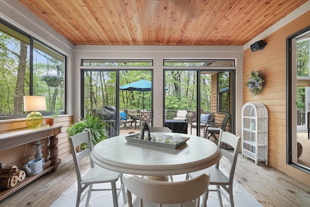 326 Greentree Ln NE, Ada, MI 49301 - sunroom with outdoor dining area and an outdoor living space