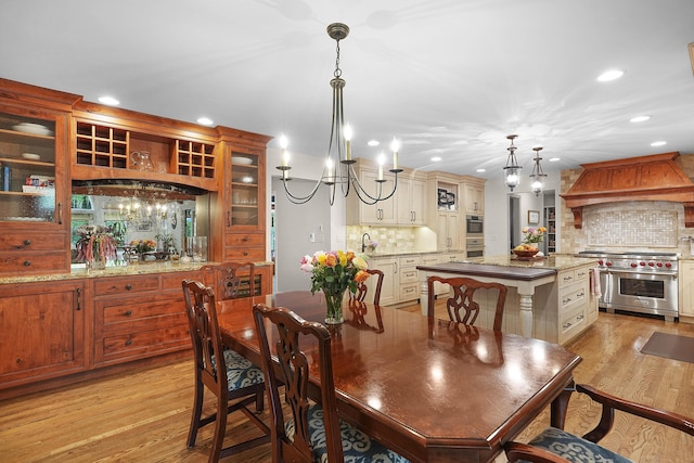 326 Greentree Ln NE, Ada, MI 49301 - dining space with recessed lighting, light wood-style flooring, and a chandelier