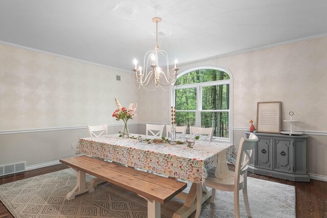 326 Greentree Ln NE, Ada, MI 49301 - dining space with dark wood finished floors, a chandelier, crown molding, wallpapered walls, and baseboards
