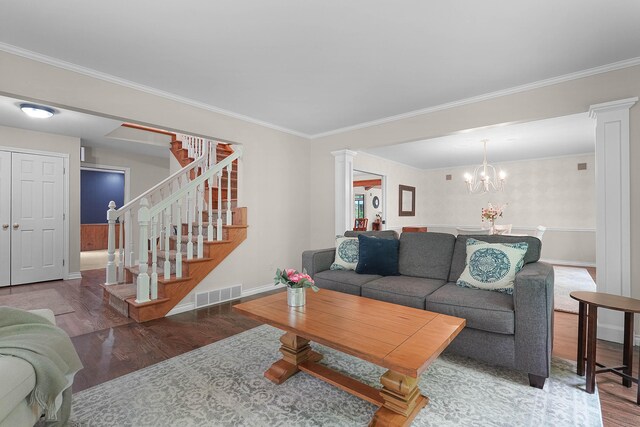 326 Greentree Ln NE, Ada, MI 49301 - living room with wood finished floors, decorative columns, stairs, ornamental molding, and baseboards