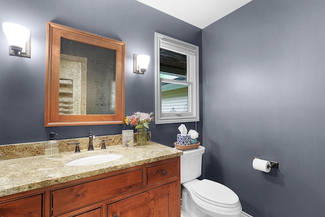 326 Greentree Ln NE, Ada, MI 49301 - bathroom featuring toilet, vanity, and baseboards