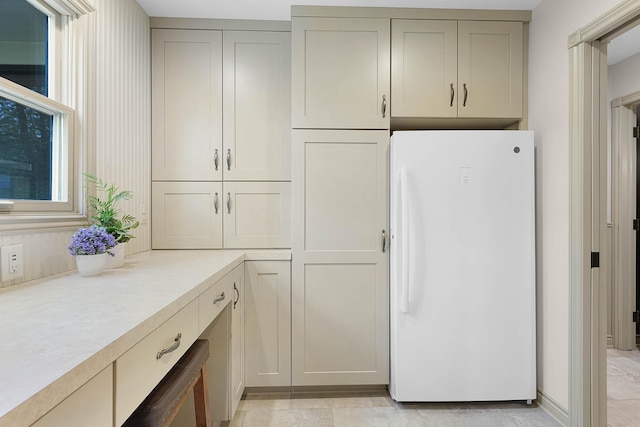 326 Greentree Ln NE, Ada, MI 49301 - kitchen featuring freestanding refrigerator, light countertops, and gray cabinets
