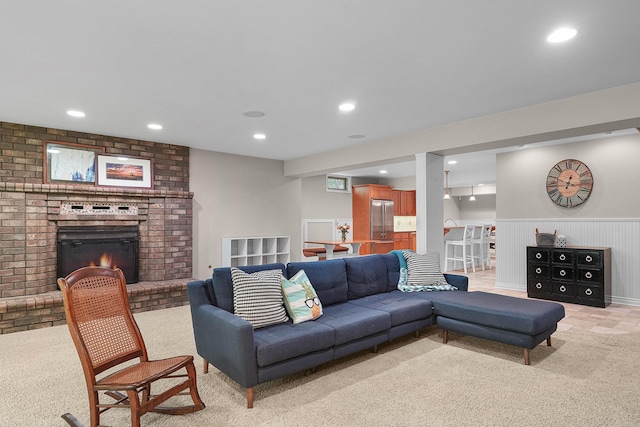 326 Greentree Ln NE, Ada, MI 49301 - living area with light colored carpet, recessed lighting, and a brick fireplace