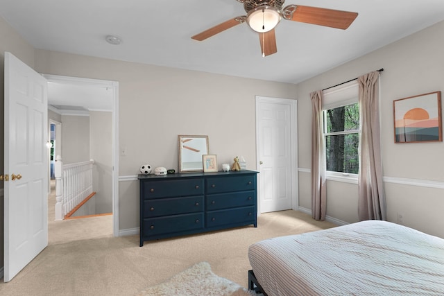 326 Greentree Ln NE, Ada, MI 49301 - bedroom featuring light colored carpet, baseboards, and ceiling fan