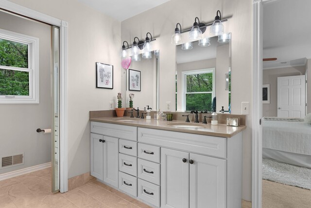 326 Greentree Ln NE, Ada, MI 49301 - full bath featuring ensuite bathroom, double vanity, and baseboards