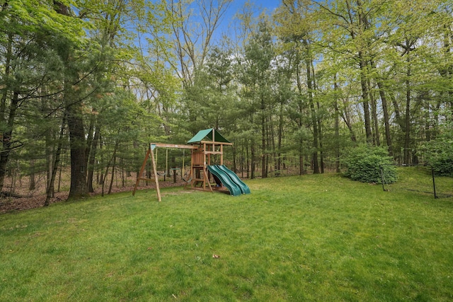 326 Greentree Ln NE, Ada, MI 49301 - view of grassy yard with a playground and a forest view
