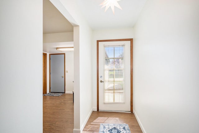 250 Appletree Ln, Holland, MI 49423 - doorway to outside with baseboards and light wood-type flooring