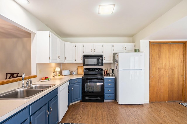 250 Appletree Ln, Holland, MI 49423 - kitchen with a sink, blue cabinets, black appliances, white cabinetry, and light wood-style floors