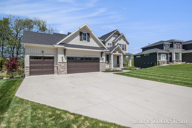 1791 Gloryfield Dr, Byron Center, MI 49315 - craftsman-style home featuring driveway, stone siding, a garage, a front lawn, and board and batten siding