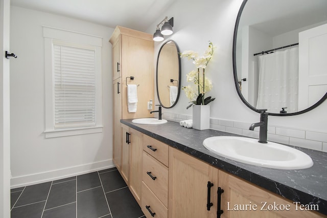 1791 Gloryfield Dr, Byron Center, MI 49315 - bathroom with baseboards, tile patterned flooring, double vanity, and backsplash