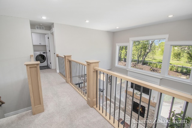 1791 Gloryfield Dr, Byron Center, MI 49315 - hallway featuring washer / dryer, light colored carpet, an upstairs landing, and recessed lighting