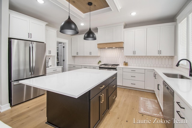 1791 Gloryfield Dr, Byron Center, MI 49315 - kitchen featuring appliances with stainless steel finishes, a sink, light wood-style flooring, white cabinetry, and recessed lighting