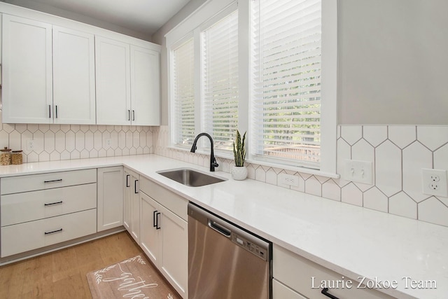 1791 Gloryfield Dr, Byron Center, MI 49315 - kitchen with dishwasher, a sink, tasteful backsplash, and white cabinets