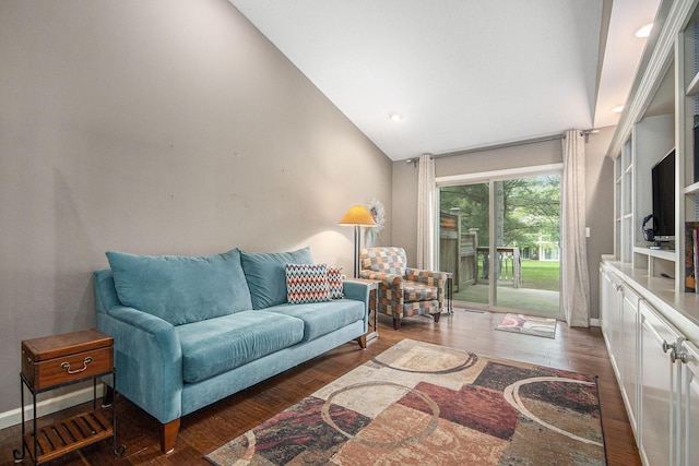 4289 Millpond Dr NE, Rockford, MI 49341 - living room with wood finished floors, baseboards, and high vaulted ceiling