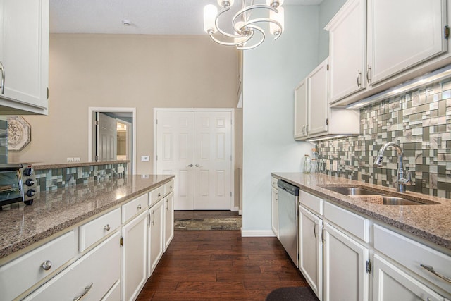 4289 Millpond Dr NE, Rockford, MI 49341 - kitchen featuring tasteful backsplash, a sink, white cabinets, and dark wood-style floors