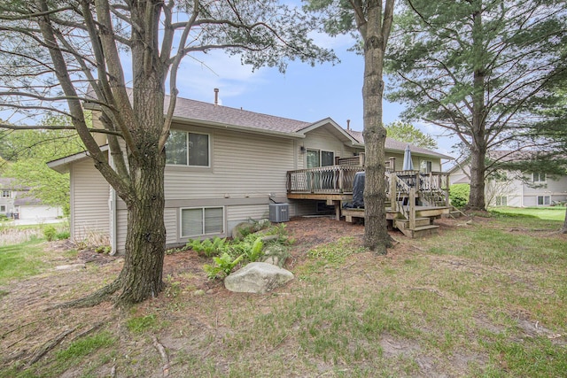 4289 Millpond Dr NE, Rockford, MI 49341 - back of house featuring a deck, central air condition unit, and a shingled roof