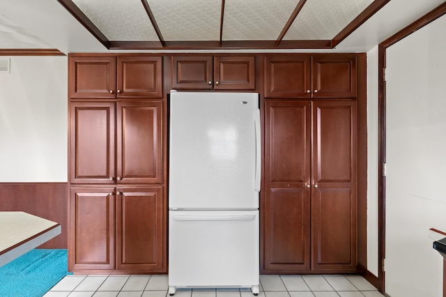 416 Barberry Ave, Portage, MI 49002 - kitchen with freestanding refrigerator, visible vents, and light tile patterned floors