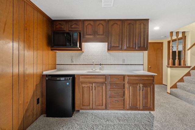 416 Barberry Ave, Portage, MI 49002 - kitchen with a sink, black microwave, refrigerator, and light countertops