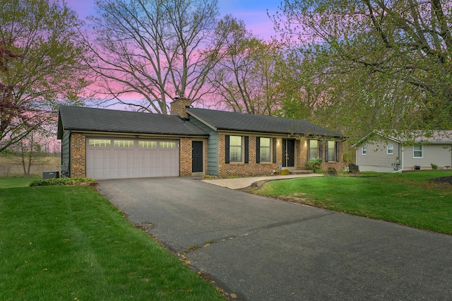 416 Barberry Ave, Portage, MI 49002 - ranch-style home featuring brick siding, a garage, a front yard, a chimney, and driveway