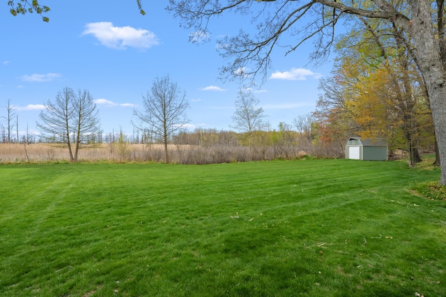 416 Barberry Ave, Portage, MI 49002 - view of yard featuring an outdoor structure, a storage shed, and a rural view